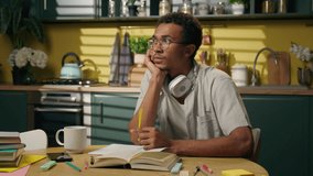 Sad upset thoughtful guy pensive African American man businessman gen z high school student distant study think difficult problem doubt frustrated male homework brainstorm uncertain at home kitchen - Powered by Shutterstock - Get 15% off with code: PIKWIZARD15