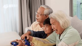 Elderly couple and child joyfully play video games together in a bright living room - Powered by Shutterstock - Get 15% off with code: PIKWIZARD15