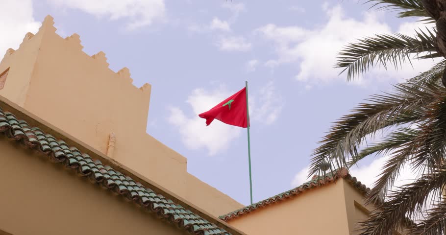 Moroccan flag waving in the courtyard of the Mausoleum of Moulay Ali Cherif, near Erfoud, eastern Morocco 