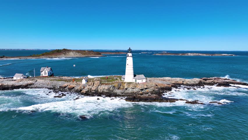Boston Lighthouse on Little Brewster Island in Boston Harbor, Boston, Massachusetts MA, USA.