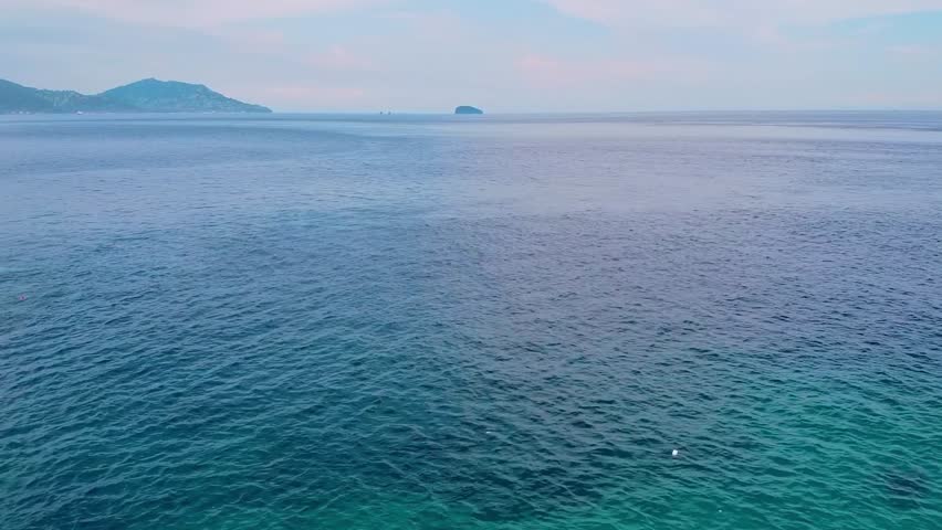 Drone captures Yinyang Sea in Shuinandong, Taiwan, where iron-rich runoff meets seawater, creating two-toned ocean colors.