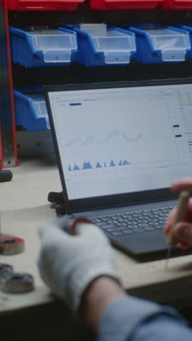 Handyman Doing Manual Work, Checking Real-Time Stocks, Exchange Market Charts on Laptop and Digital Tablet. Man Making Investments During Working Hours, Combining Job with Trading. Vertical Shot.
