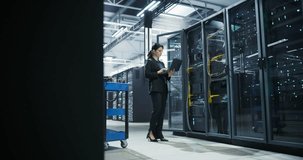 Data Center Female IT Specialist Using Laptop in Server Room. Artificial Intelligence Computing Facility with Maintenance Administrator Working on Computer. Information Technology Professional - Powered by Shutterstock - Get 15% off with code: PIKWIZARD15