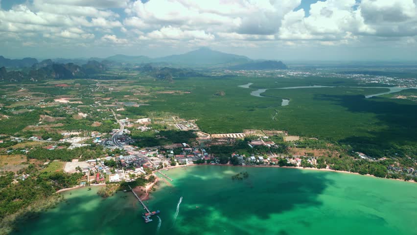 Beautiful aerial drone shot over Ao Nam Mao Beach in Krabi, Thailand. Coastal village, turquoise water, mangroves, and rivers ideal for travel, tourism, or environmental promos.