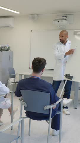 Doctor giving lesson to medical students in slow motion