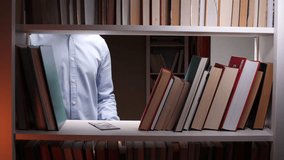 Librarian counting banknotes behind bookshelf in library - Powered by Shutterstock - Get 15% off with code: PIKWIZARD15