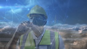 Engineer making smartphone call and manipulating animated network overlay for wind turbine analysis. Renewable, technology, innovation, visualization, industry, sustainability, digital - Powered by Shutterstock - Get 15% off with code: PIKWIZARD15