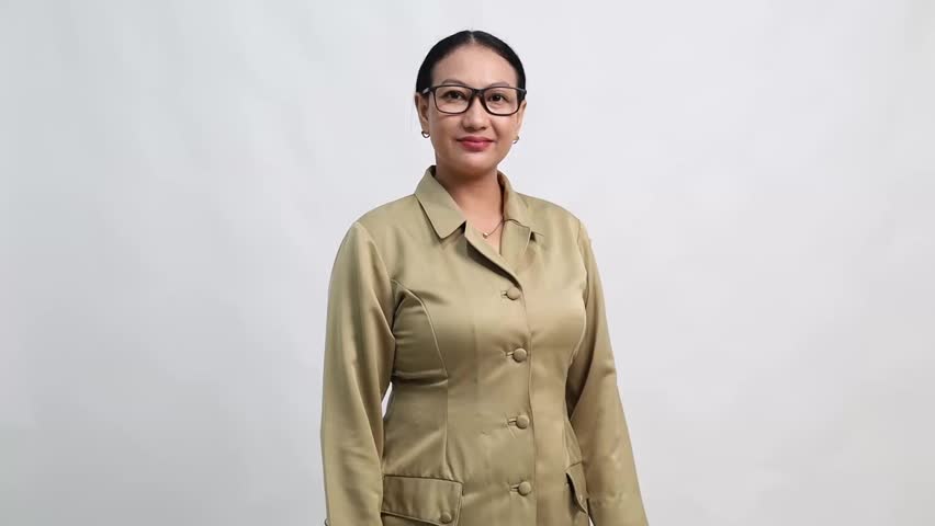 Surprised Indonesia government worker woman gesturing presenting with both hands raised, looking to the side, isolated on white background