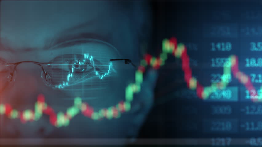 Trader wearing glasses is working on laptop computer. Screen with stock market charts and Bitcoin BTC or Ethereum ETH data analysis reflection. Broker trading online. Altcoins crypto currency trading