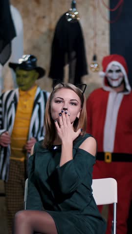 Halloween party, photo session, young people dressed up in scary costumes and made a horrific make-up.