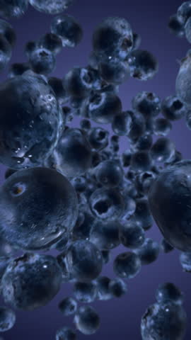 Raw juicy blueberries exploding and flying in super slow motion. Blueberry drops after explosion. High speed 1000fps vertical video
