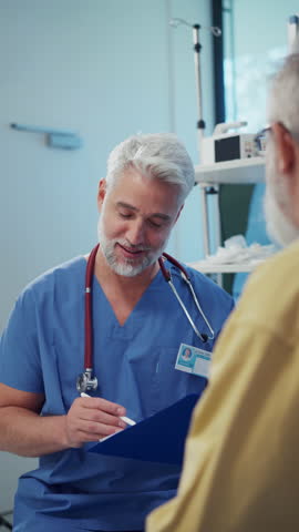 Patient sitting on examination table, talking with doctor about symptoms.