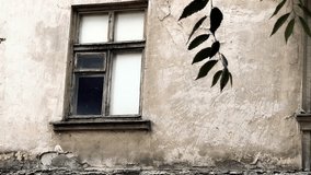 old window in a dilapidated house. old broken wooden window in the wall. wall of a house with cracks. abandoned house. - Powered by Shutterstock - Get 15% off with code: PIKWIZARD15