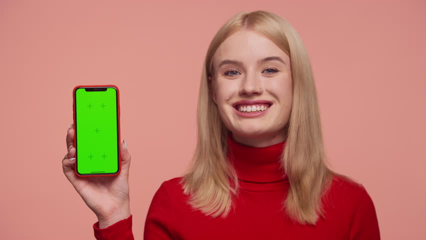 Happy customer showing smartphone with positive app feedback