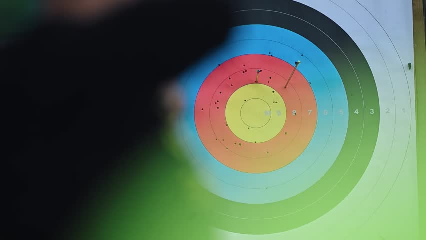 Archery practice at a training range focusing on target shooting and skill improvement