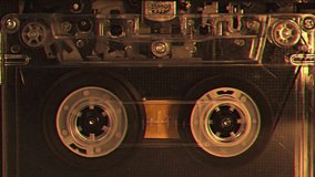 Vintage audio cassette tape recorder playing. Old school magnetic analogue reel player 1980s - 1990s. Retro style album and music technology history concept. Historical voice record FBI or CIA archive - Powered by Shutterstock - Get 15% off with code: PIKWIZARD15