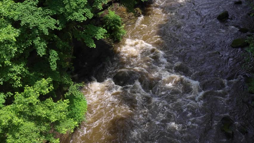 Whitewater rapids rush through the rocky gorge of the Cuyahoga River at High Bridge Glens in Summit County, Ohio — a restored natural escape near Akron and Cuyahoga Falls.