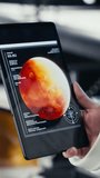 Vertical video Astronaut inside high tech spacecraft checking red planet summary analytics during routine mission check. Orbit station cosmonaut using device, standing near monitor showing Mars data - Powered by Shutterstock - Get 15% off with code: PIKWIZARD15