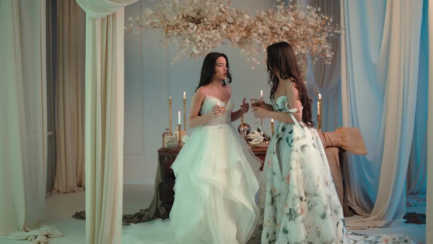 Candid shot of two beautifull female brides during their wedding ceremony indoor 