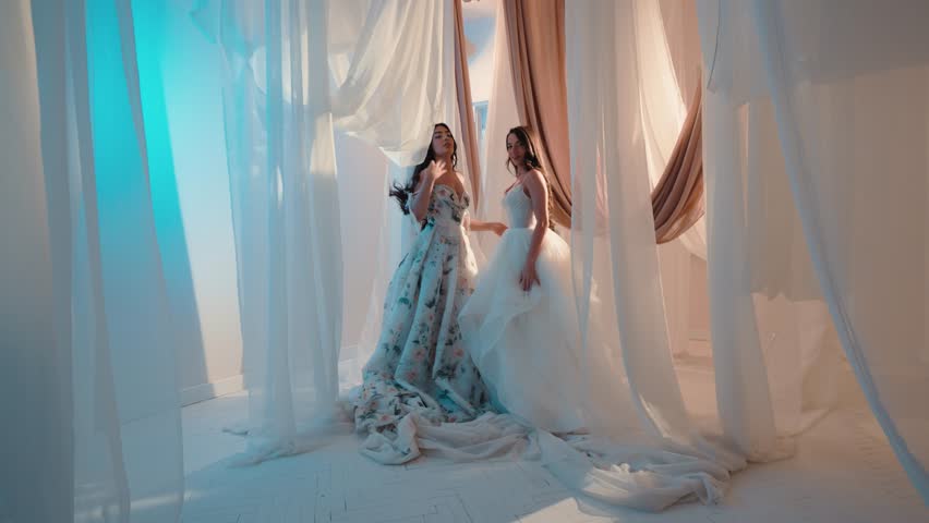 Candid shot of two beautifull female brides during their wedding ceremony indoor 