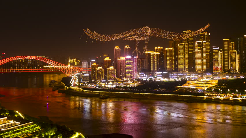 CHONGQING, CHINA - 28 MAY 2025 : Timelapse of the amazing Chongqing cyberpunk city skyline from a high vantage point at night