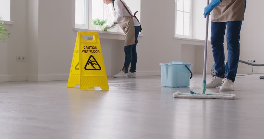 Cleaning company clean up premises working together. People in cleaning company maintaining cleanliness teamwork and team spirit Cleaning company men and women working together clean up job