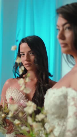 Candid shot of two beautifull female brides during their wedding ceremony indoor 