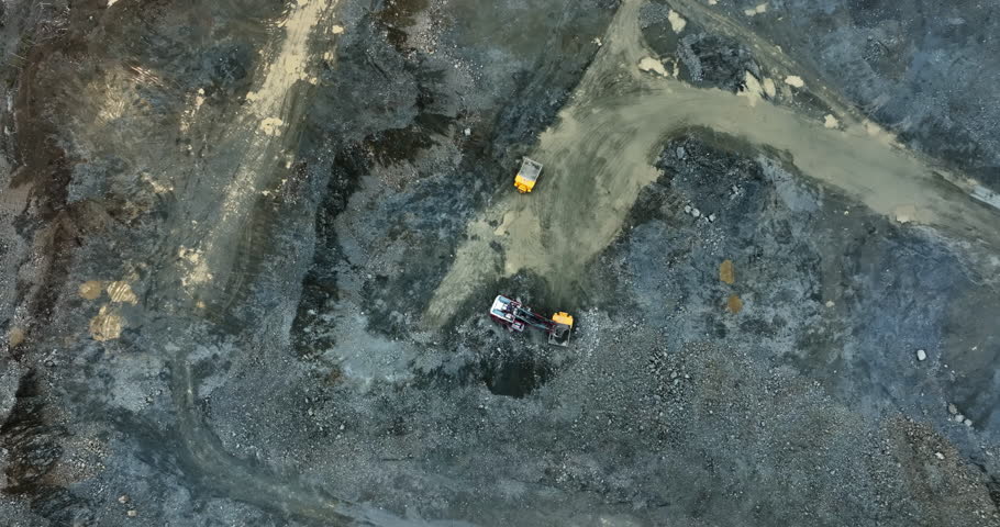 Heavy machinery working together in open pit mine. Stock clip