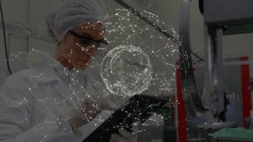 Female technician observing holographic sphere materializing in plant, adjusting tablet controls. Futuristic, technology, industrial, innovation, data, analysis, engineering - Powered by Shutterstock - Get 15% off with code: PIKWIZARD15