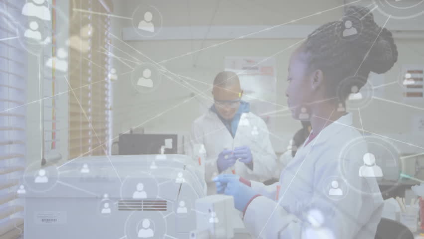 Lab scientist lifting centrifuge lid as colleague pipetting, network icons fading for data exchange. Research, innovation, equipment, technology, collaboration, science, precision - Powered by Shutterstock - Get 15% off with code: PIKWIZARD15