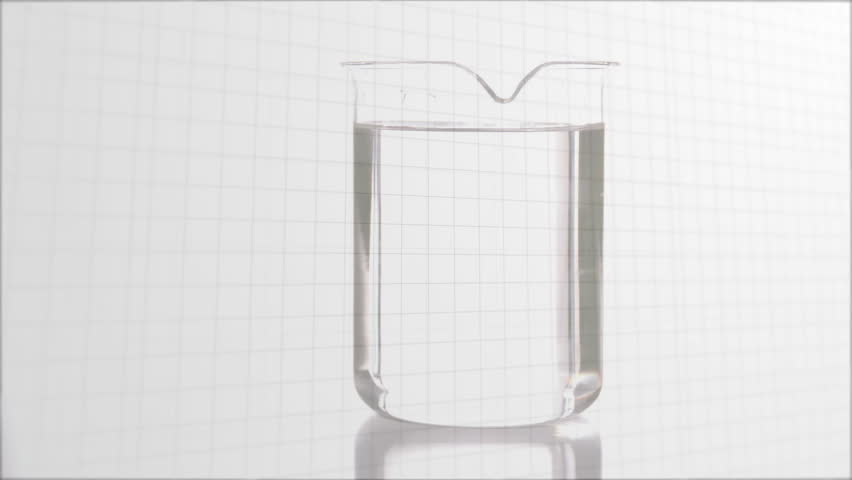 Syringe appearing injecting orange liquid into beaker, splashing color, updating virus data visuals. Laboratory, analytics, innovation, data visualization, biotech, science, experimentation - Powered by Shutterstock - Get 15% off with code: PIKWIZARD15