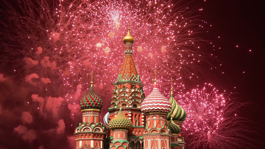 Temple of Basil the Blessed and fireworks in honor of Victory Day celebration (WWII), Red Square, Moscow, Russia. Time lapse 