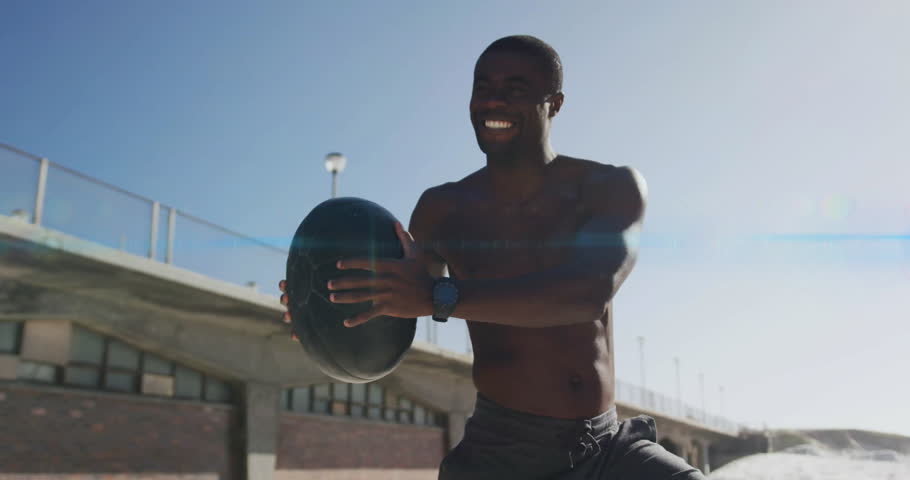 Shifting onto right leg athlete doing medicine ball twists engaging core animated fitness metrics. Athlete, fitness, strength, training, outdoor, athleticism, motion