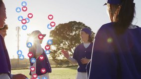 Female baseball teammates high-fiving and initiating hearts thumbs-up icons using AR during sunset. Team, camaraderie, celebration, outdoor, youthful, modern, connection - Powered by Shutterstock - Get 15% off with code: PIKWIZARD15