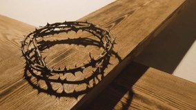 religious concept shot with crown of thorns and wooden cross in pool of light stock video - Powered by Shutterstock - Get 15% off with code: PIKWIZARD15