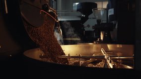 Freshly roasted coffee beans are poured into a cooling tray and mixed to release excess heat and ensure even roasting in a professional coffee roasting facility - Powered by Shutterstock - Get 15% off with code: PIKWIZARD15