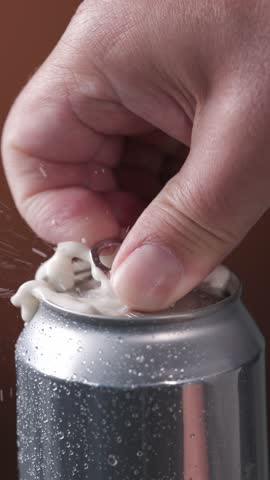 Human hand open aluminum beverage can. Drink in metal jar closeup. Opening soda can