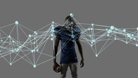 Footballer tracking digital network passing on chest and adjusting helmet to show sports analytics. Athlete, sports, technology, fitness, innovation, motion, performance - Powered by Shutterstock - Get 15% off with code: PIKWIZARD15