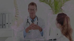 Doctor lifting medical spine model, pointing vertebrae and explaining anatomy for patient care. Medical, education, professional, anatomical, healthcare, diagnostic, consultation - Powered by Shutterstock - Get 15% off with code: PIKWIZARD15