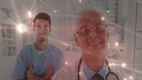 Doctor initiating pulsing network overlay, showing patient data over colleague in hospital corridor. Medical, technology, futuristic, healthcare, collaboration, innovation, clinical - Powered by Shutterstock - Get 15% off with code: PIKWIZARD15