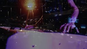 Musician pressing keyboard initiating traffic timelapse blending music performance with cityscape. Instrument, ambiance, neon, melody, digital, performance, nightscape - Powered by Shutterstock - Get 15% off with code: PIKWIZARD15