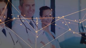 Three doctors standing mesh starting across stethoscopes from right revealing colleague in scrubs. Medical, healthcare, professionalism, collaboration, technology, innovation, teamwork - Powered by Shutterstock - Get 15% off with code: PIKWIZARD15