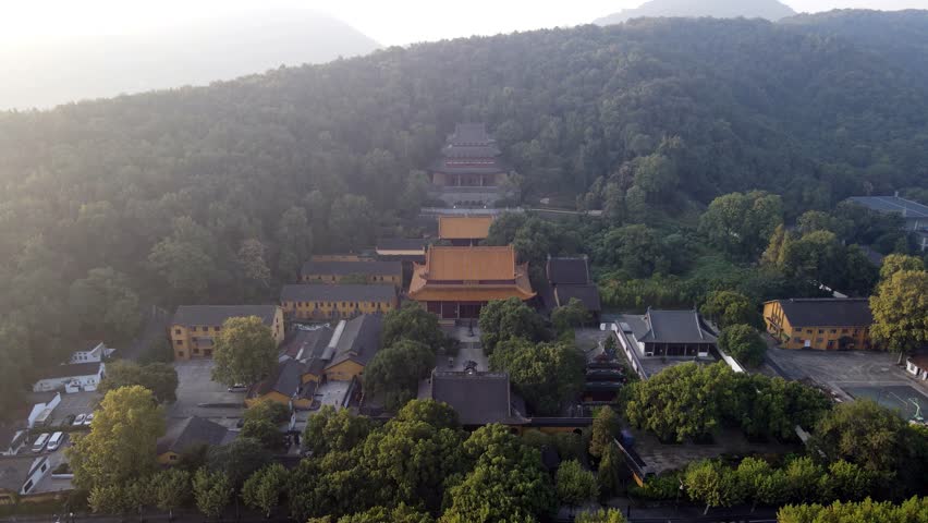 Drone captures Pure Temple from above, one of the Ten West Lake views in Hangzhou, China, nestled between lush green mountains
