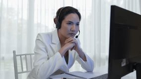 Businesswoman wearing headset working in office to support remote customer or colleague. Frustrated and tired call center customer support agent facing problem on providing vivancy service - Powered by Shutterstock - Get 15% off with code: PIKWIZARD15