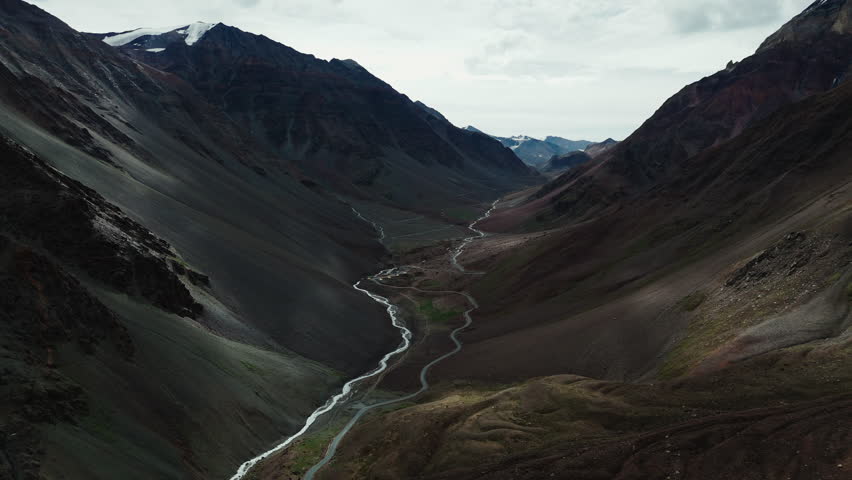 Mountain Road and Glacial Stream in Deep Valley of Ladakh Drone View