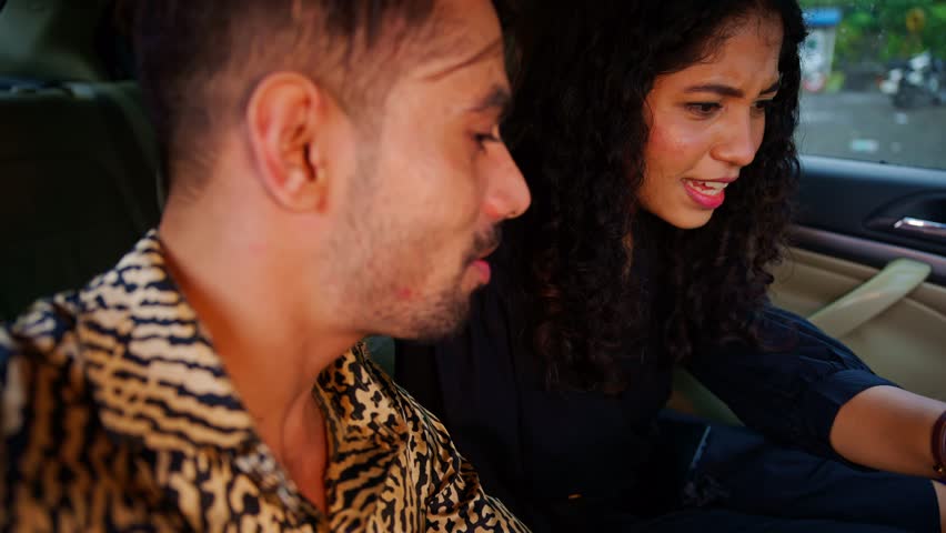 Affectionate Lovers Share Tracks Through Car Audio System, Romantic Couple Bonds Over Music in Vehicle, Passionate Pair Scrolls by Play list Joyfully, Cozy Date Inside motorcar with Love and Lyrics