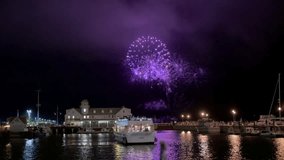 Great fireworks in the night sky over the lake dedicated to July 4th or New Years celebrations. Wide view shot - Powered by Shutterstock - Get 15% off with code: PIKWIZARD15