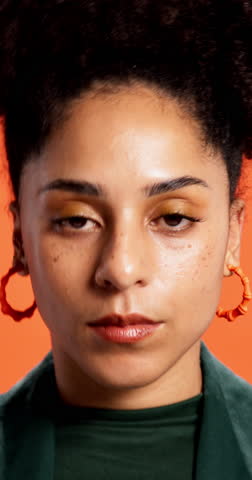 Face, annoyed and woman roll eyes in studio background with bad attitude, whatever and confrontation. Portrait, female person and frustrated for negative behaviour, conflict reaction and deny mistake