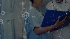 Medical team turning patient file toward doctor and activating digital overlay for analyzing charts. Healthcare, collaboration, technology, diagnostics, professional, hospital, digital - Powered by Shutterstock - Get 15% off with code: PIKWIZARD15