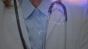 Senior medical doctor raising head while network overlay circling stethoscope welcoming patients. Healthcare, medical, professional, technology, innovation, diagnostics, wellness - Powered by Shutterstock - Get 15% off with code: PIKWIZARD15